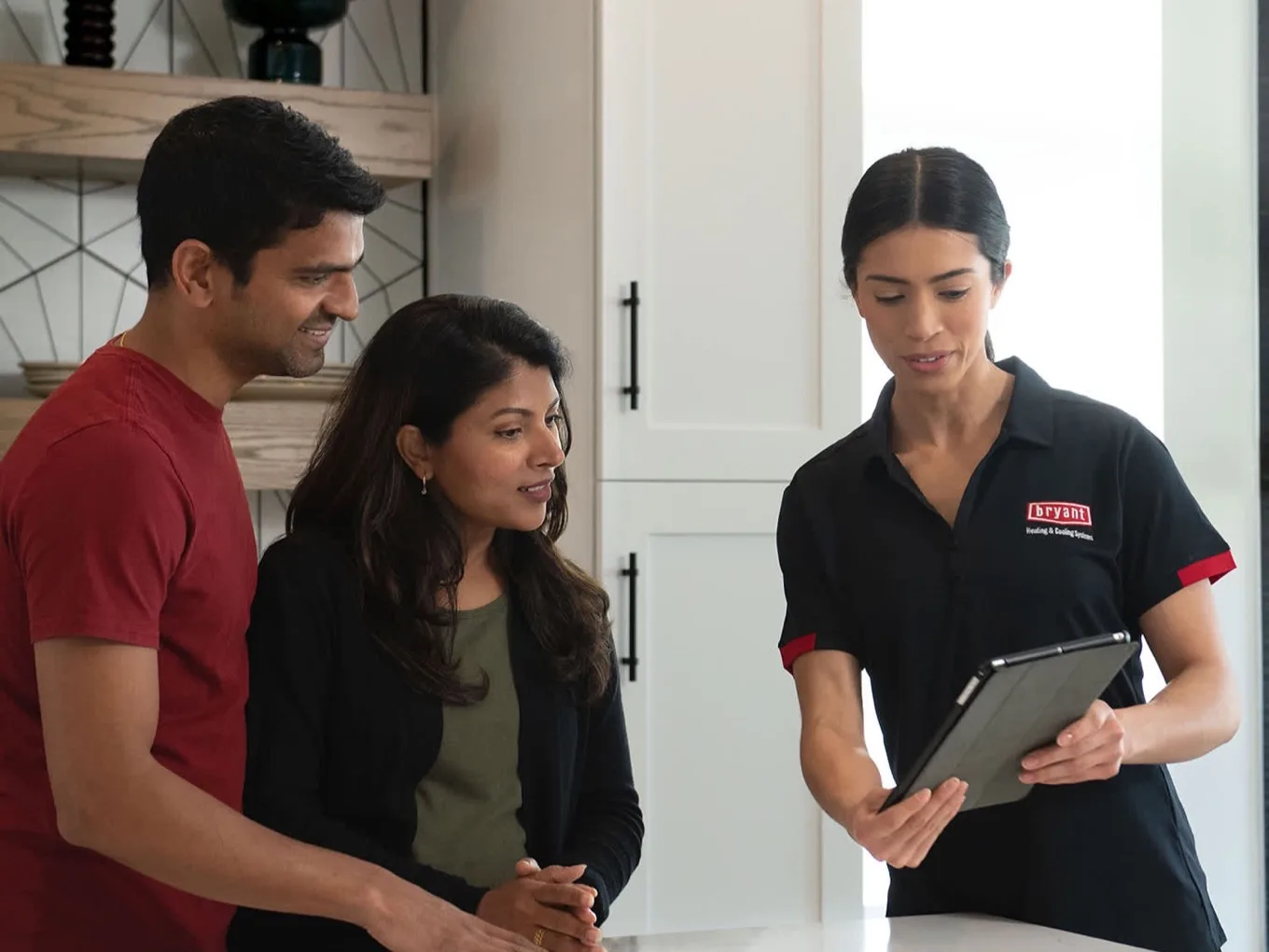 A Bryant advisor walks homeowners through system controls on a tablet