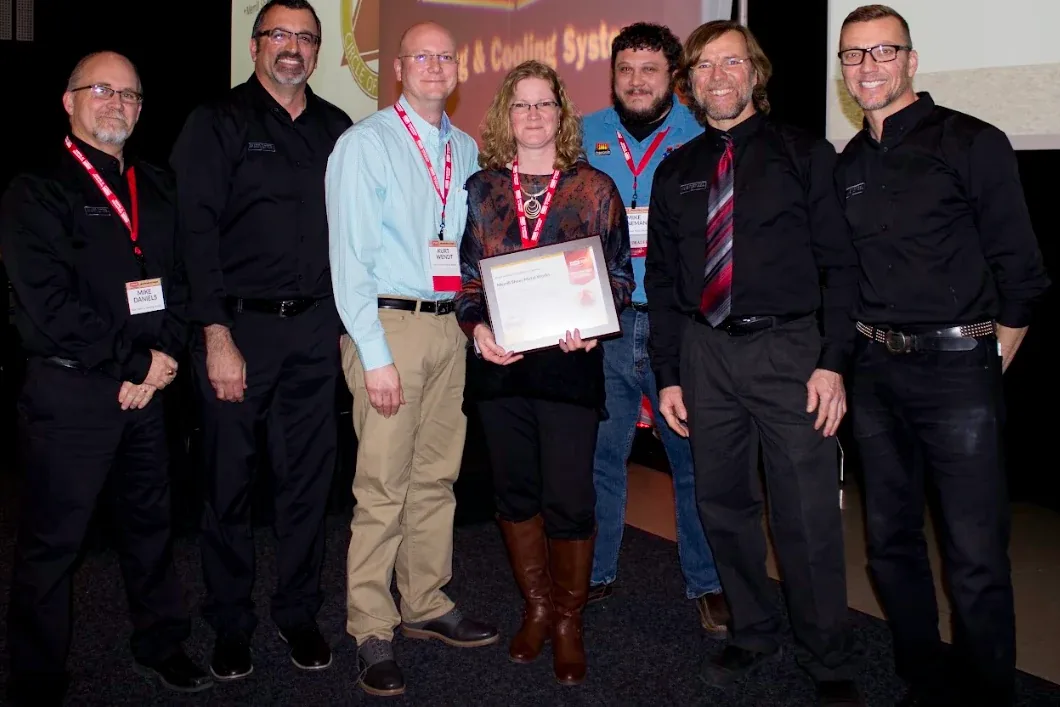 The crew on stage at a Bryant dealer awards night